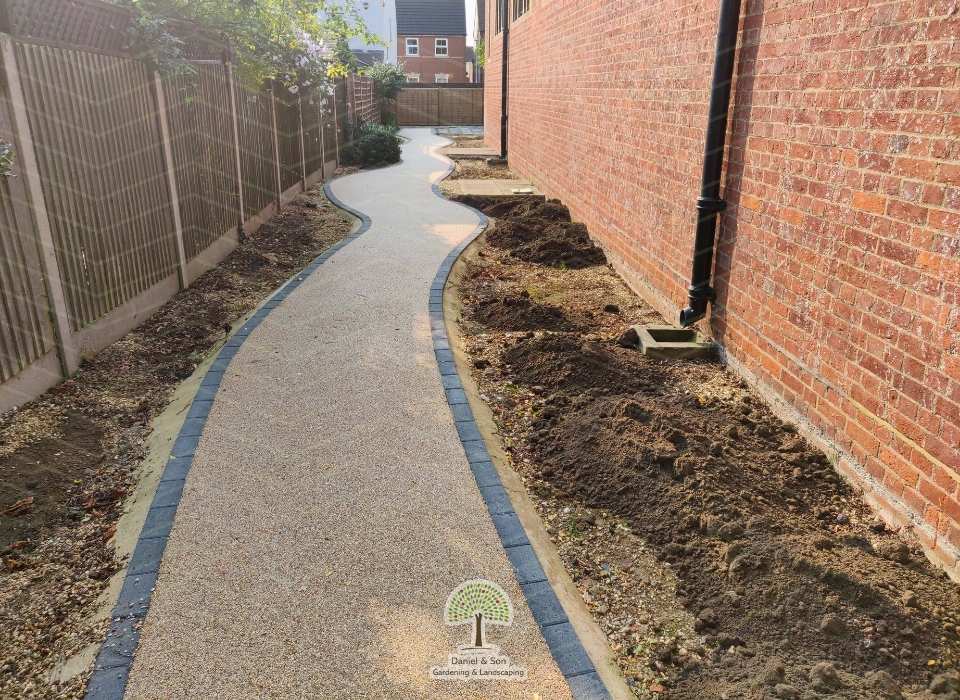 revamp the rear path and garden with new plants and flowers 